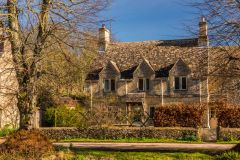 Cotswold stone cottage near the village pond