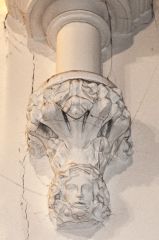 A fanciful carved corbel head