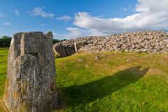 A standing stone and the cairn
