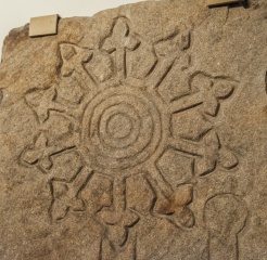 Early cross slab head in the north transept