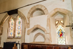 Blocked Norman and 13th century doorways, chancel