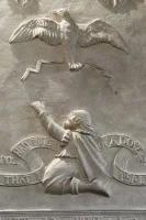 Plasterwork figure, north chancel wall