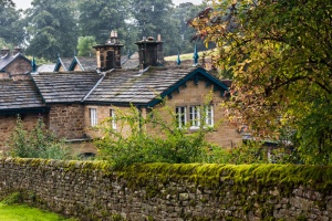 Stone wall and estate cottages