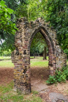 A mock ruined gateway in the grounds