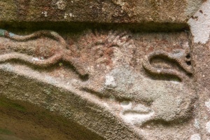 Heraldic carving over a doorway arch