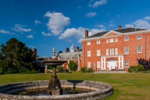 The house front and garden fountain