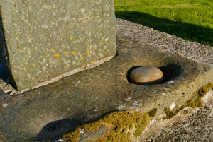 The wishing holes at the cross base