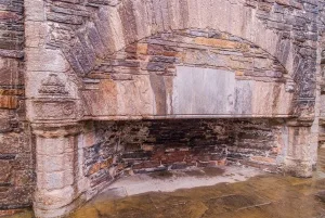 A fireplace in the Great Hall