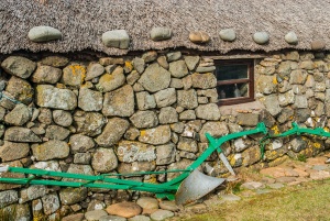 Plough outside a croft wall