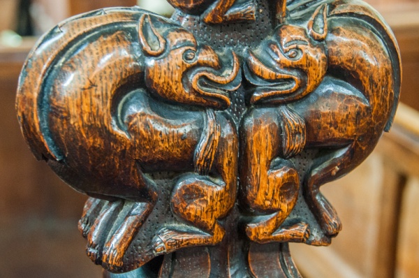 Medieval bench end of two dragons, St Andrew's Church, Northwold