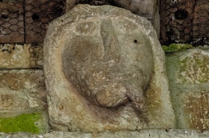 Grotesque carving over the north door