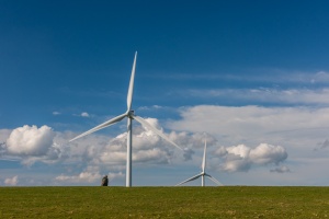The Monolith and wind turbines from the lane
