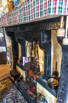 The original kitchen fireplace