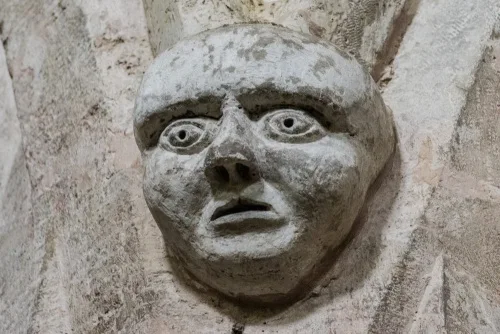 Carved head, nave arcade