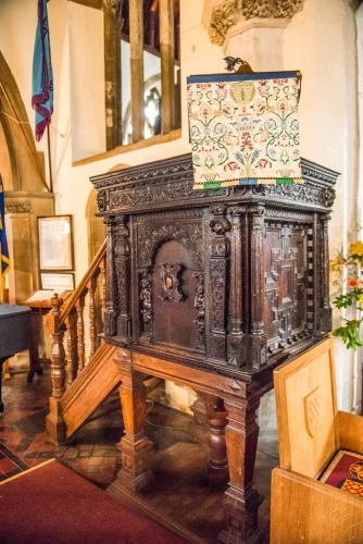 The richly carved Jacobean pulpit