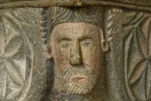 Carved face, 12th-century font