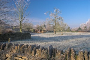 A stone wall by the village green