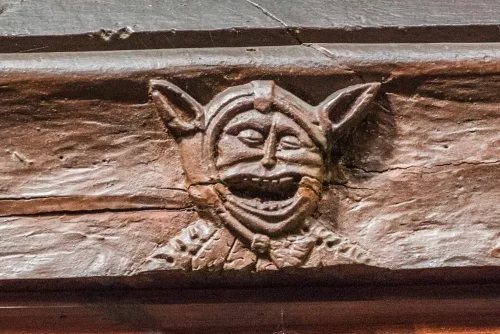 Carved face on the 1536 restoration beam