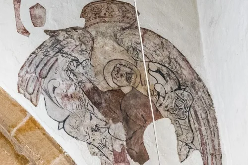 Medieval wall painting of a robed figure