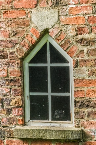 A triangular-headed window