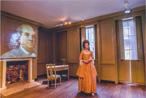 'Polly Hewson' guides visitors around the house