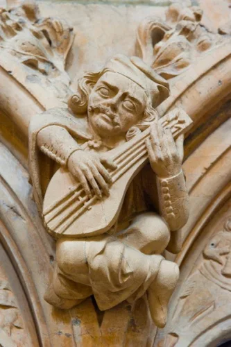 A medieval carving of a musician
