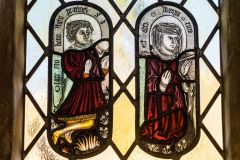 Replica stained glass roundels of medieval church donors