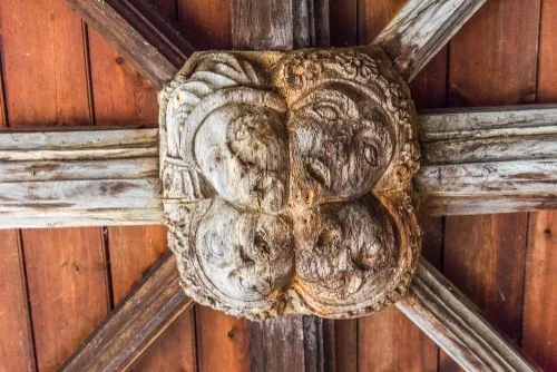 An unusual four-headed boss in the porch
