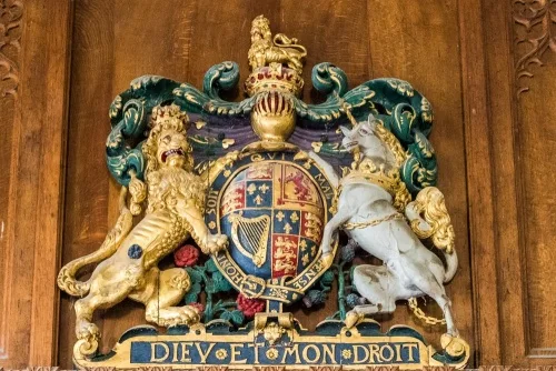 The Royal Coat of Arms with a black rose