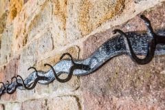 Wrought-Iron coat hangers on the wall