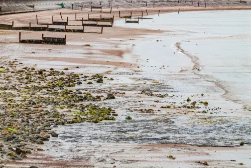 Coastal defences now protect the church from the sea