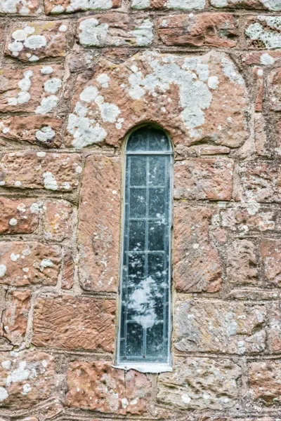 Norman lancet window, south wall