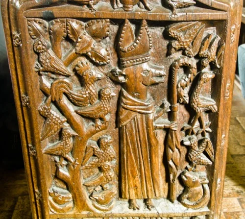 Bench end of an abbot dressed as a fox