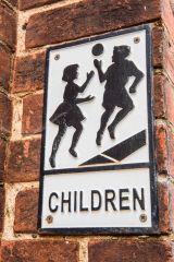 An appropriate sign on the old schoolroom wall