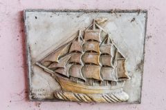 A sculptural plaque in the summerhouse