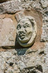 A medieval carved head set into the wall