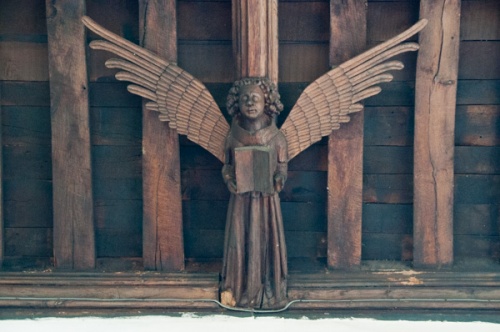 A carved angel figure in the south aisle