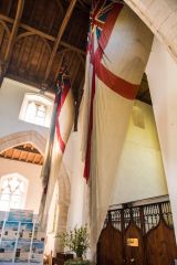 Burnham Thorpe, All Saints Church, Battle flags over the west end of the nave