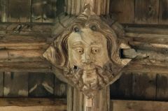 Carved roof boss of a bearded man