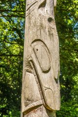 A closer look at the Canadian totem pole in the woodland garden