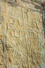 A medieval cross set into the porch wall