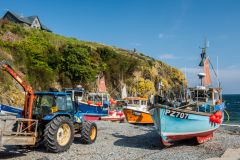 Boats drawn up on the shingled harbour