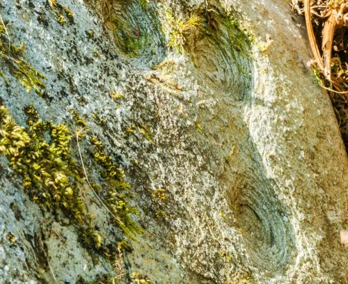 Cup marks on an upright stone
