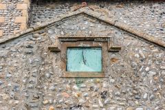 An old sundial on the south transept wall