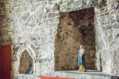 Medieval piscina and niche in the sanctuary