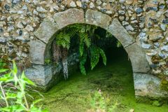One of the arched openings to admit water