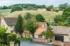 Looking over rooftops to the castle earthworks
