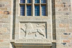 A carved lion over the castle entrance