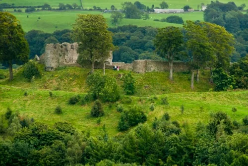 Kendal Castle in the distance across the River Kent