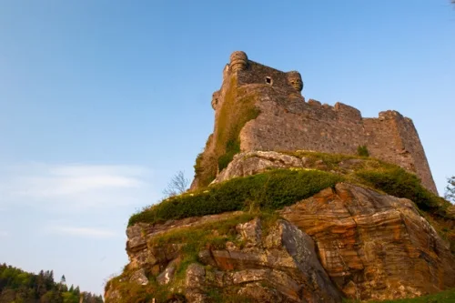 The castle atop its rocky tor